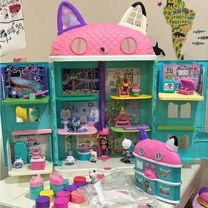 Gabby’s dollhouse with ears and sing along boom box.